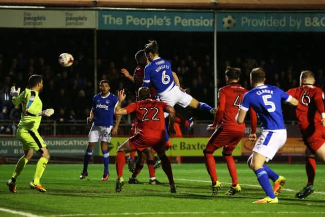 Christian Burgess scores at Crawley last season. Picture: Joe Pepler