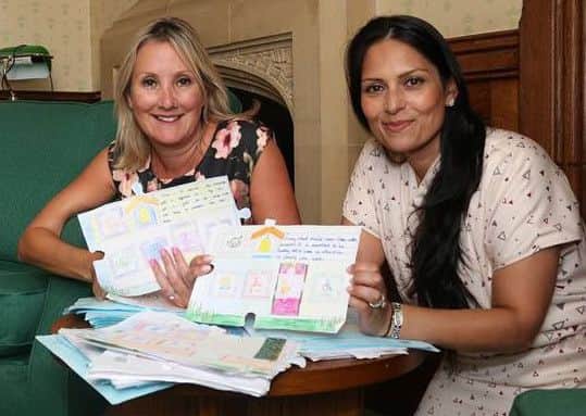 Caroline Dinenage with Priti Patel, the Secretary of State for International Development