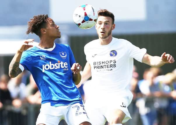 Bradley Tarbuck, right, in action against Pompey during pre-season. Picture: Joe Pepler