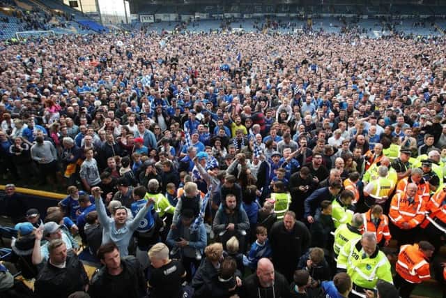 The Fratton faithful celebrate the League Two title against Cheltenham