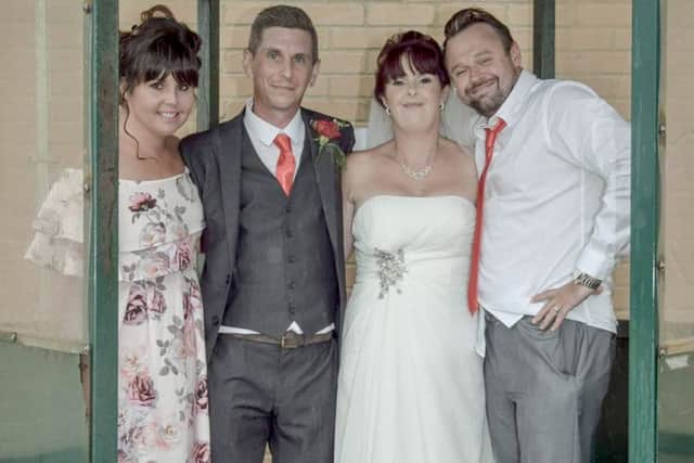 Cheryl, left, with bride and groom Kelly and James, centre, and her husband James. Picture: Georgia Stanhope