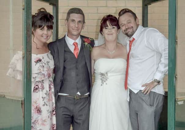 Cheryl, left, with bride and groom Kelly and James, centre, and her husband James. Picture: Georgia Stanhope