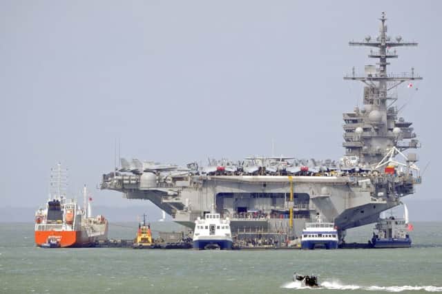 The USS George HW Bush at anchor in Stokes Bay, Gosport, Hampshire, England
Picture: Malcolm Wells (170727-6460)
