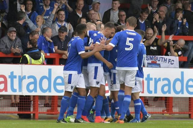Pompey celebrate Brett Pitman's first goal at Crawley. Picture: Neil Marshall