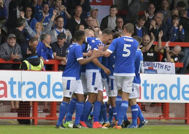 Pompey celebrate Brett Pitman's first goal at Crawley. Picture: Neil Marshall