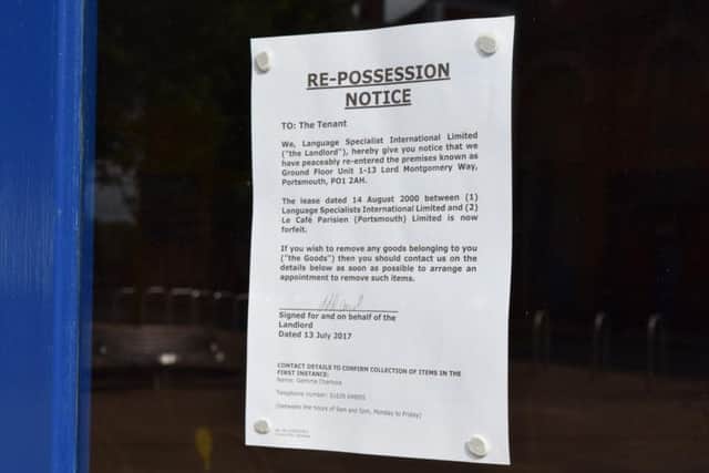 The re-possession notice on the window of the cafe