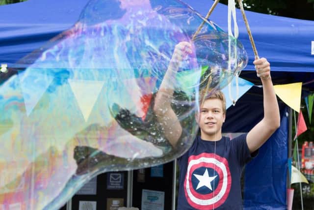 Aidan Whitlock, 13, creates giant bubbles.
Picture by Habibur Rahman