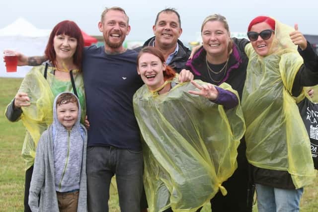 Friends and family having fun on Saturday despite the rotten weather
Picture: Habibur Rahman