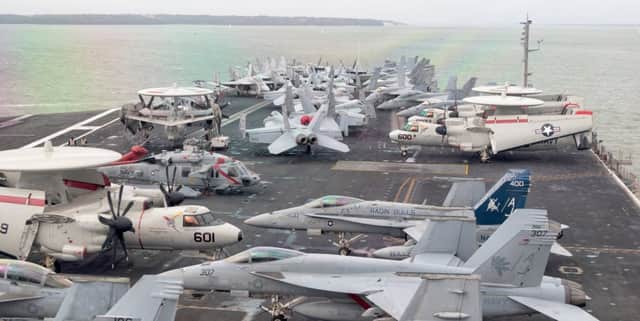 F18 Super Hornets on the flight deck of USS George H W Bush 



Picture: Mark Rutley