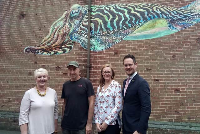 The cuttlefish mural by artist ATM was unveiled on Saturday
