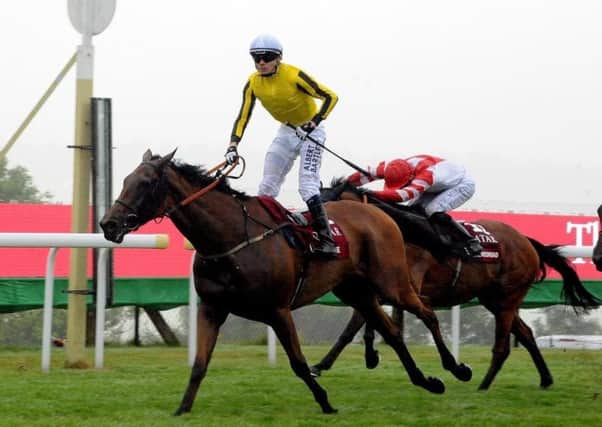 Big Orange and Jamie Spencer win the 2016 Goodwood Cup. Picture by Kate Shemilt