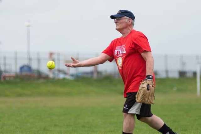 A British player fields at the softball game

Picture by Vernon Nash
