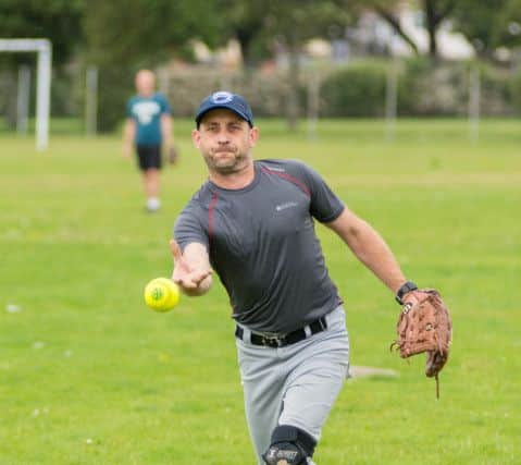 A pitcher at the softball game with USS George HW Bush

Picture by Vernon Nash