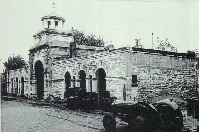 Landport Gate with No1 and No2 St George's Road on either side. This view was taken from within the sports ground. Note the new brickwork on the right, bomb damage repairs.
