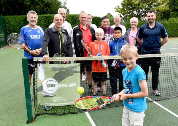 Tristan Oliver, seven, with, far right, Simon Johnson, LTA head of region for the south west and Cllr Linda Symes