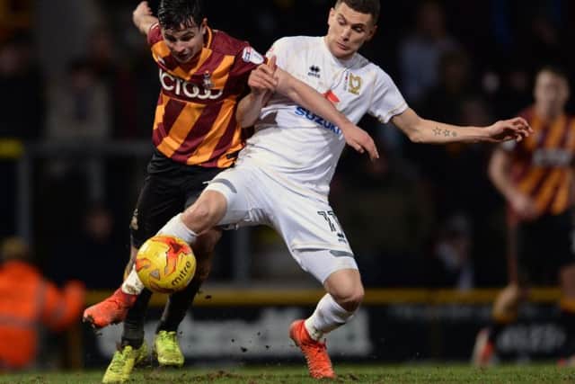 Stuart O'Keefe, right, in action for MK Dons against Bradford last season Picture: Bruce Rollinson