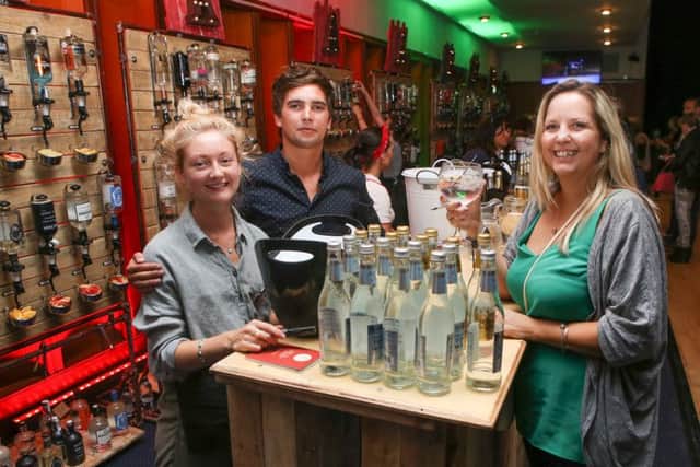 Kirsty Joyner, Felix Charles and Vicky Ashton with plenty of choice at Portsmouth Gin Festival     Pictures: Habibur Rahman