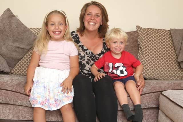 Surrogate mother Kim Bradshaw with her children, Olivia seven, and Eli, three. Picture: Habibur Rahman