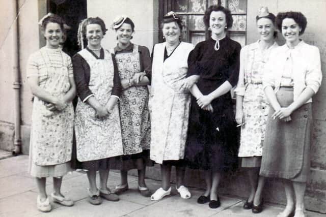 Grandma Aylmer (centre) with her six daughters in Henrietta Street, Somers Town, Portsmouth.