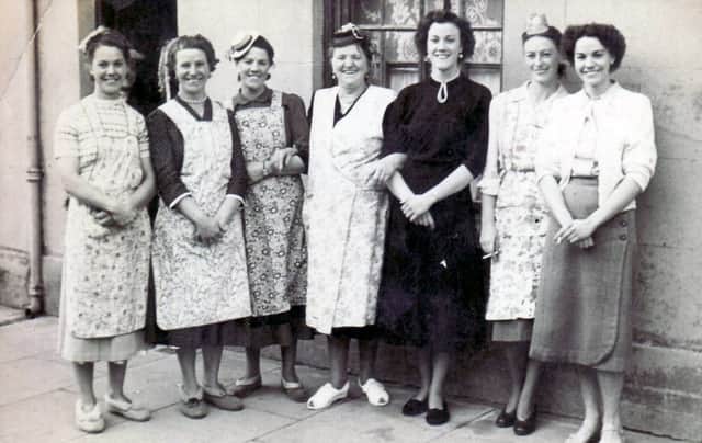 Grandma Aylmer (centre) with her six daughters in Henrietta Street, Somers Town, Portsmouth.