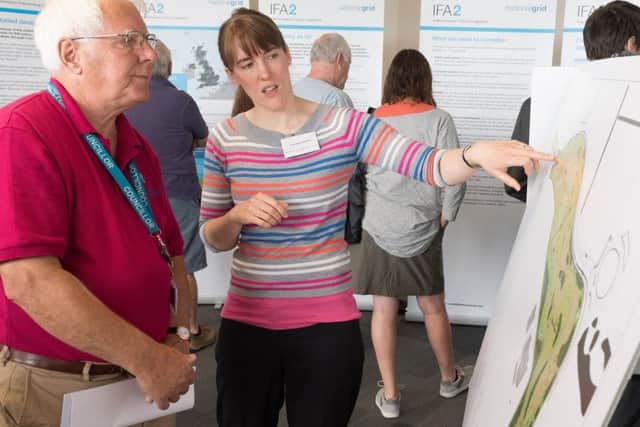 Day  2 of a two of day public consultation on proposed IFA2 development on the former HMS Daedalus site. - "Gosport councillor for Lee West, John Beavis MBE discuss's the plan with Charlotte Hayden".  Picture Credit: Keith Woodland PPP-170307-110329001