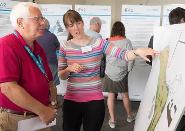 Day  2 of a two of day public consultation on proposed IFA2 development on the former HMS Daedalus site. - "Gosport councillor for Lee West, John Beavis MBE discuss's the plan with Charlotte Hayden".  Picture Credit: Keith Woodland PPP-170307-110329001