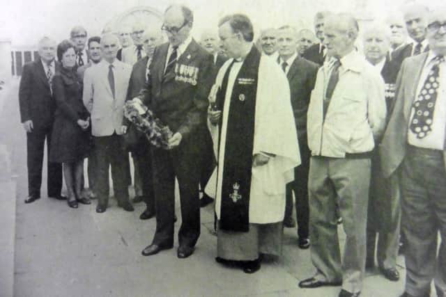 Dick Dimon, from Doncaster, who was an able seaman leading torpedo operator in HMS Delight, laying a wreath at the war memorial on Southsea Common at the first reunion of the survivors of the ship.