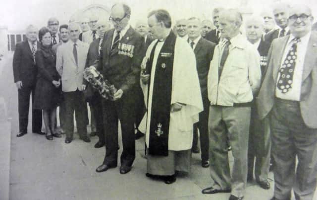 Dick Dimon, from Doncaster, who was an able seaman leading torpedo operator in HMS Delight, laying a wreath at the war memorial on Southsea Common at the first reunion of the survivors of the ship.