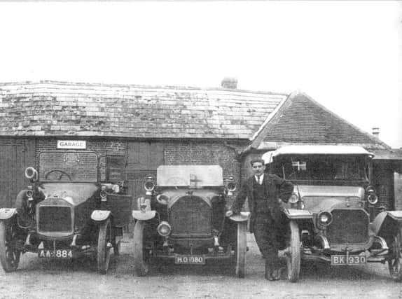 Vic Hutfield beside the vehicle, right, which might have been used for the trip to Midhurst.