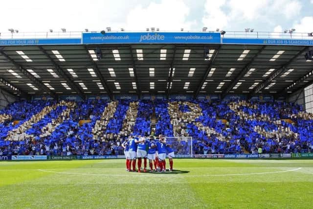 Pompey fans celebrate community ownership on the opening day of the 2013-14 season. Picture: Joe Pepler