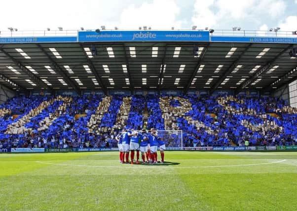 Pompey fans celebrate community ownership on the opening day of the 2013-14 season. Picture: Joe Pepler