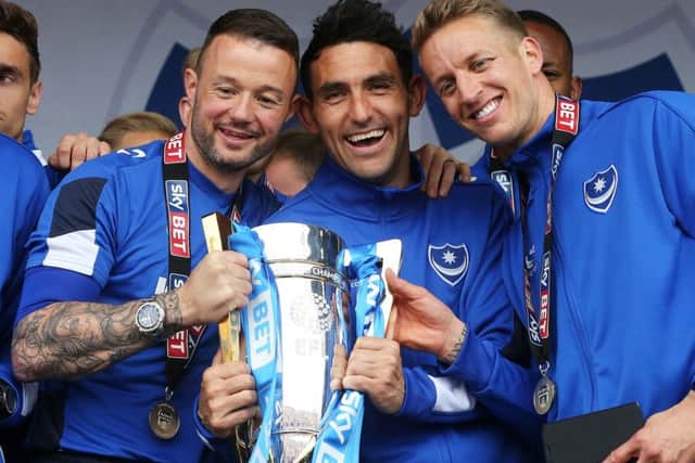 Noel Hunt, left, with the League Two trophy. Picture: Joe Pepler