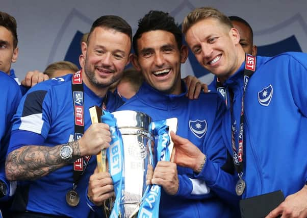 Noel Hunt, left, with the League Two trophy. Picture: Joe Pepler