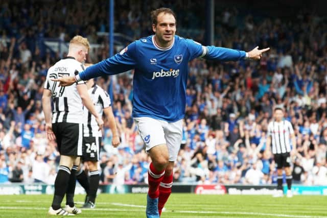 Pompey's Brett Pitmann celebrates scoring his first goal of the match against Rochdale. Picture: Joe Pepler/Digital South