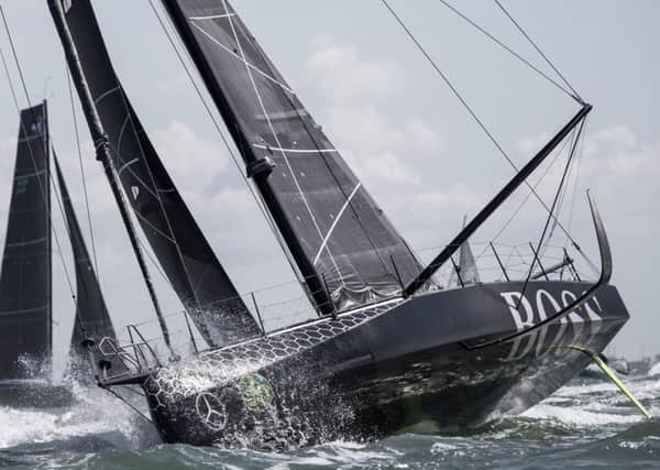HugoBoss IMOCA Open 60 race yacht skippered by Alex Thomson during the start of the 2017 Rolex Fastnet Race. Picture: Lloyd Images
