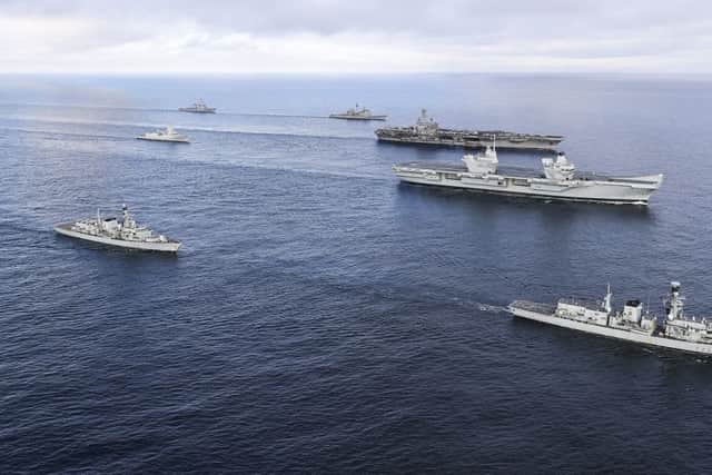 HMS Queen Elizabeth and the USS George H W Bush. To Starboard of HMS Queen Elizabeth and to the front, HMS Westminster and to the rear HMS Iron Duke. To Port of the George W Bush, to the rear USS Donald Cook and Fwd USS Philippine Sea. To the rear of the George W Bush is the HMNOWS Helge Ingstad. Picture by: LPhot Ioan Roberts