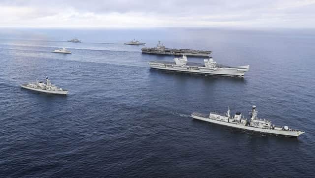 HMS Queen Elizabeth and the USS George H W Bush. To Starboard of HMS Queen Elizabeth and to the front, HMS Westminster and to the rear HMS Iron Duke. To Port of the George W Bush, to the rear USS Donald Cook and Fwd USS Philippine Sea. To the rear of the George W Bush is the HMNOWS Helge Ingstad. Picture by: LPhot Ioan Roberts