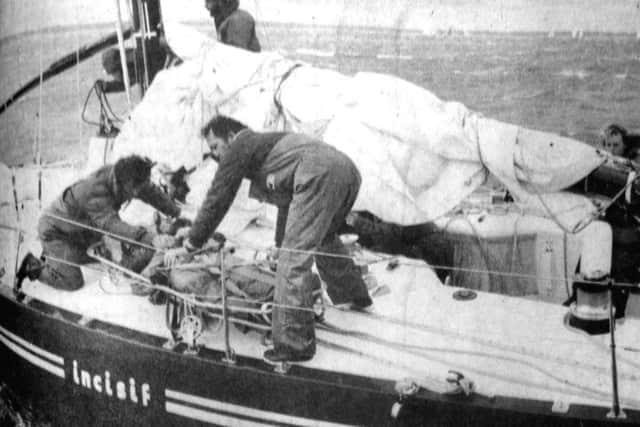 jpns-12-08-17 retro 2017Rescue - Helping hands prepare an injured crewman for his airloft to hospital