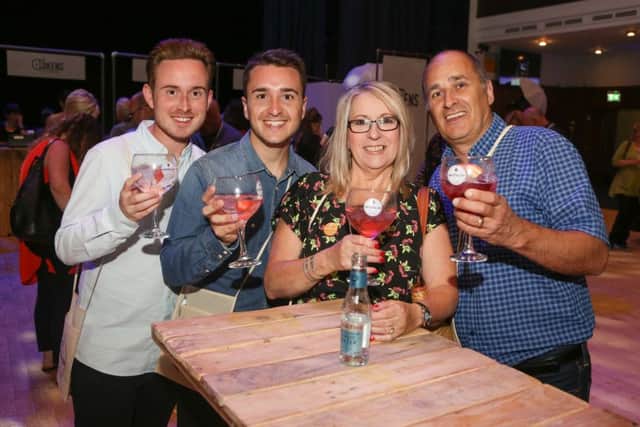 James Irwin, Ashley Brooks, Karen Brooks and John Brooks raise a glass of mother's ruin