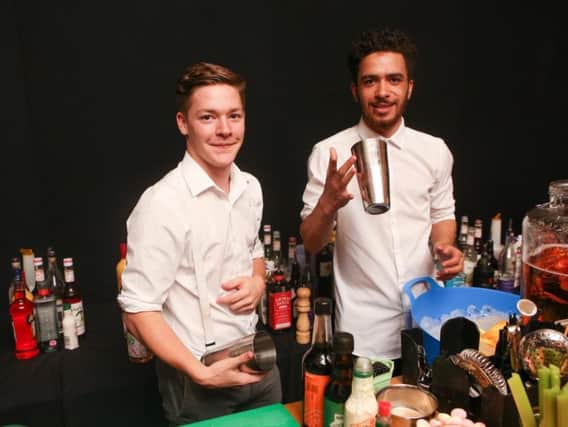 Bar staff get ready to mix some heady gin cocktails