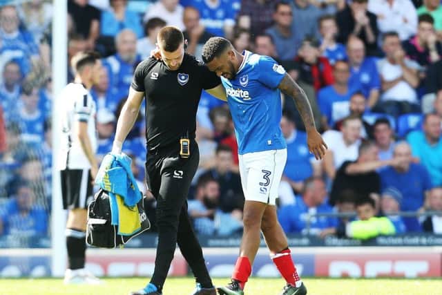 Tareiq Holmes-Dennis limps out against Rochdale. Picture: Joe Pepler