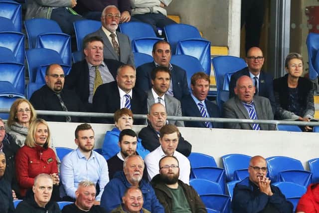 Anders Eisner, grey jacket and brother Eric to his right, watching Pompey's Carabao Cup tie at Cardiff City. Picture: Joe Pepler