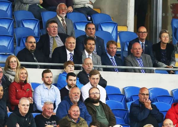 Anders Eisner, grey jacket and brother Eric to his right, watching Pompey's Carabao Cup tie at Cardiff City. Picture: Joe Pepler
