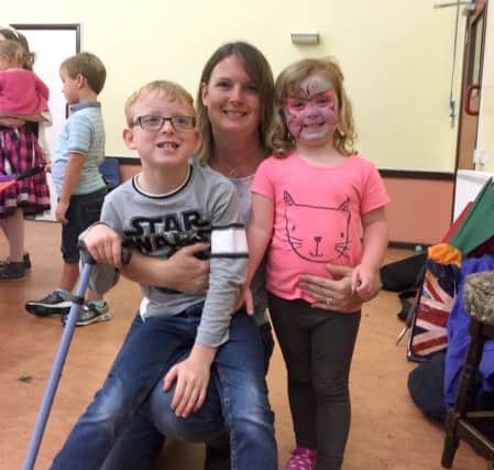 Harvey with mum Natalie and sister Amy