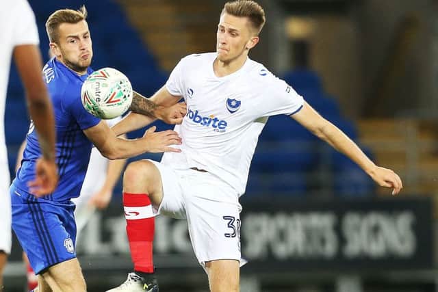 Adam May battles for the ball against Cardiff City. Picture: Joe Pepler