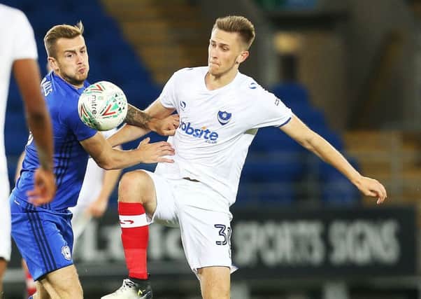 Adam May battles for the ball against Cardiff City. Picture: Joe Pepler