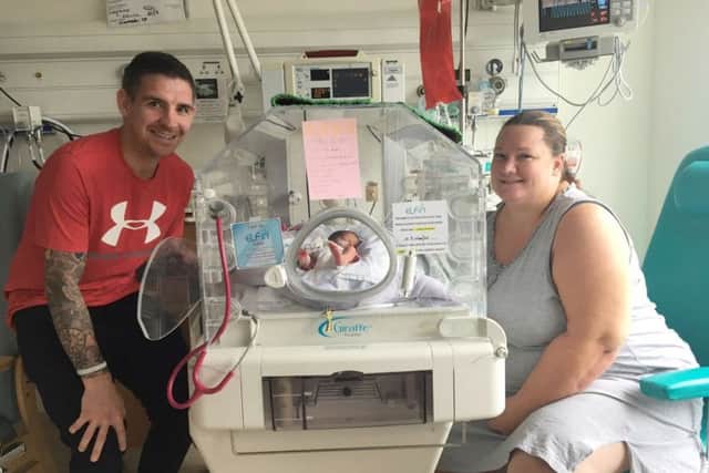 Leanne Allen and her husband Kevin with baby Harley Picture: SWNS
