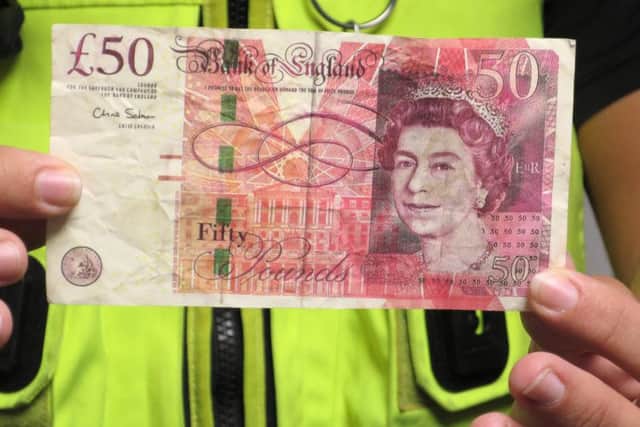 CCTV released as police probe '˜spike' in fake Â£50 notes in Portsmouth