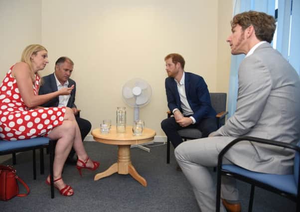 From left, 

Jane and Jamie Gailer, Prince Harry and Dominic Hurley talk about the new ID cards Picture: Sarah Lucy Brown
