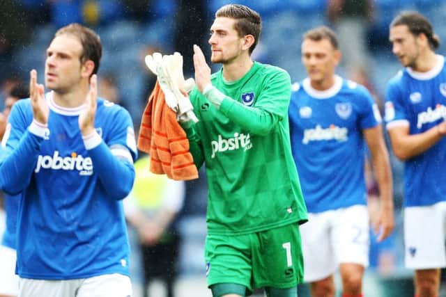Luke McGee applauds the Fratton faithful after his Pompey debut against Rochdale. Picture: Joe Pepler